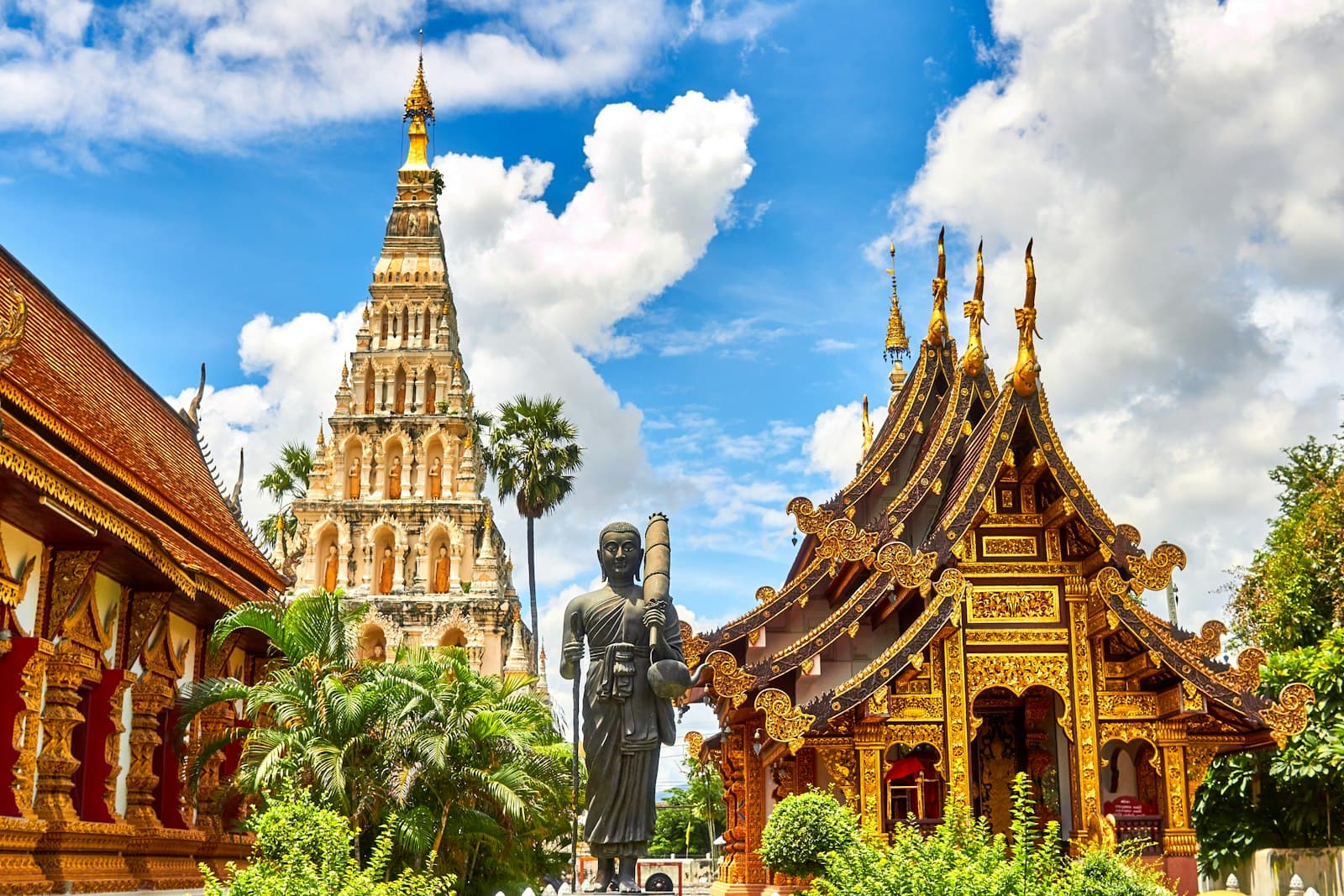 The gilded spires of a temple against a bright sky